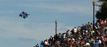 US Navy Blue Angels flying in tight formation over large crowd on Baltimore's Federal Hill 2014
