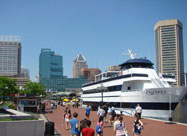 Image of Harborplace & the Inner Harbor Promenade with day-cruise ship & people enjoying the harbor, Baltimore, MD