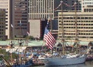 Image of U.S. Coast Guard ship with huge U.S. flag flying proudly in celebration of the 200th anniversary of the writing of our National Anthem, Inner Harbor Baltimore, MD