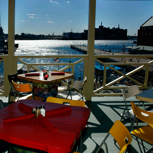 Woody's Rum Bar and Island Grill Gorgeous View of Glistening Water From Upstairs Patio Overlooking Fell's Point Harbor Baltimore MD